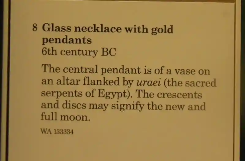 Glass necklace with gold pendants